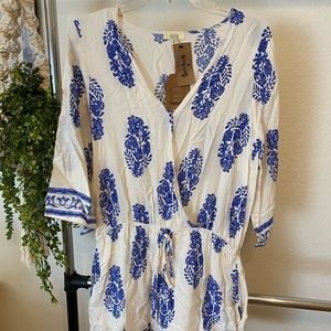 New with tags romper with pockets and draw string